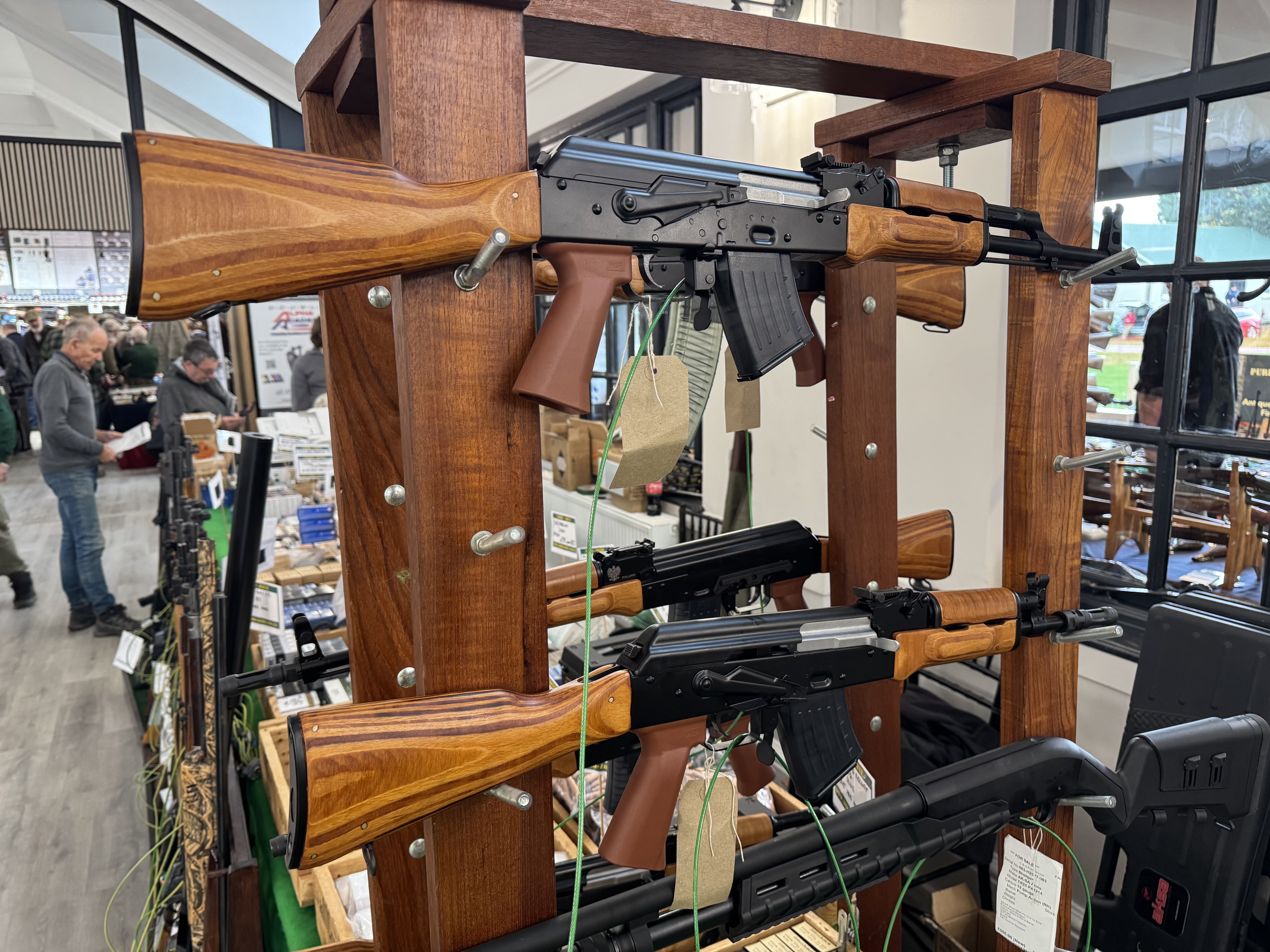 Straight-pull rifles displayed at a real firearms exhibition